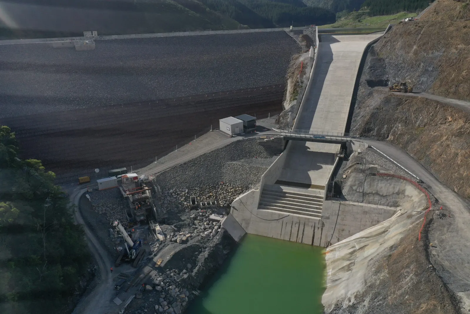 The dam spillway and plunge pool viewed towards the reservoir